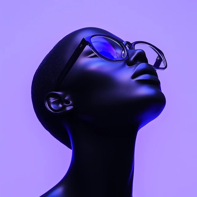 Sculptural profile lit in cobalt blue, wearing clear-framed glasses, on a lilac backdrop